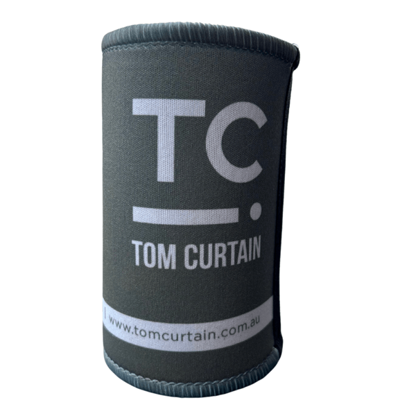Green stubby holder in blue with the Tom Curtain logo on it (TC with a line and dot)