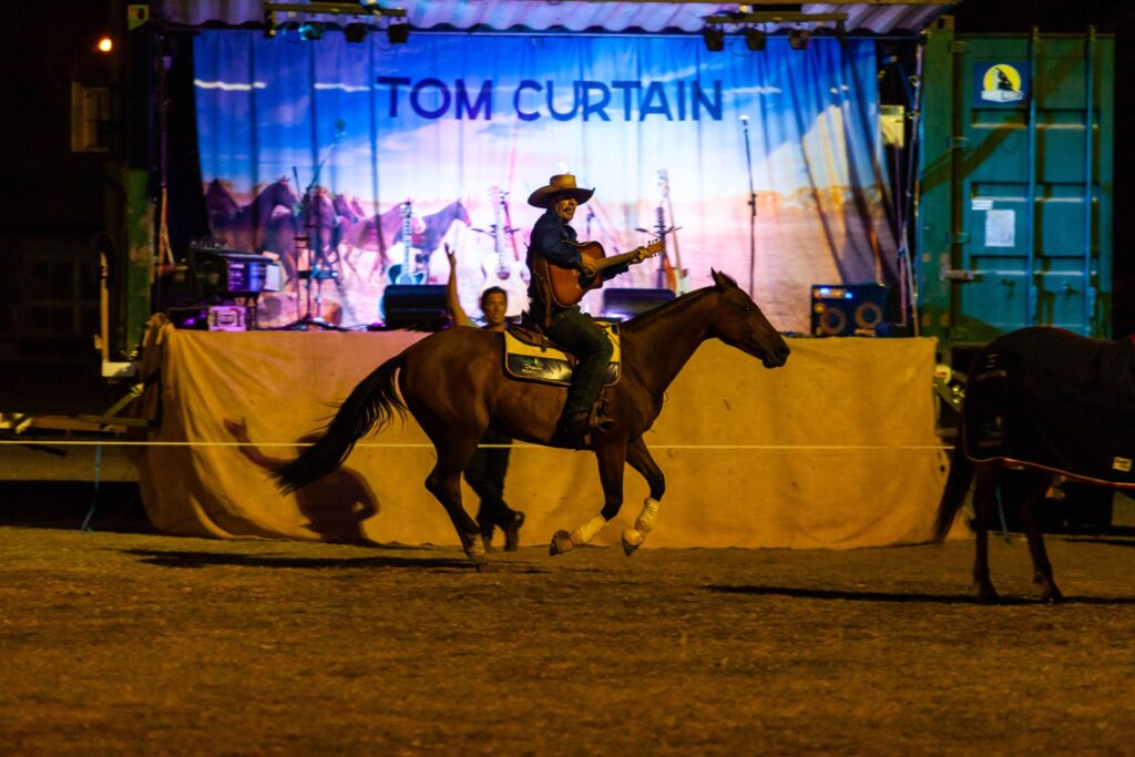 Tom Curtain performing on a horse