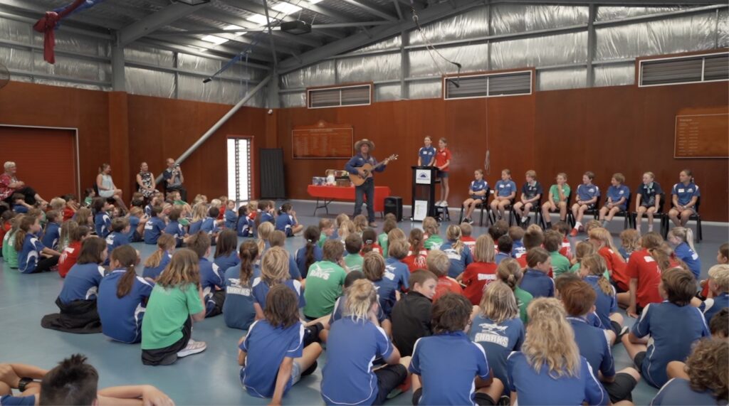 A packed primary school assembly. Spreading the anti bullying message with singer and songwriter Tom Curtain